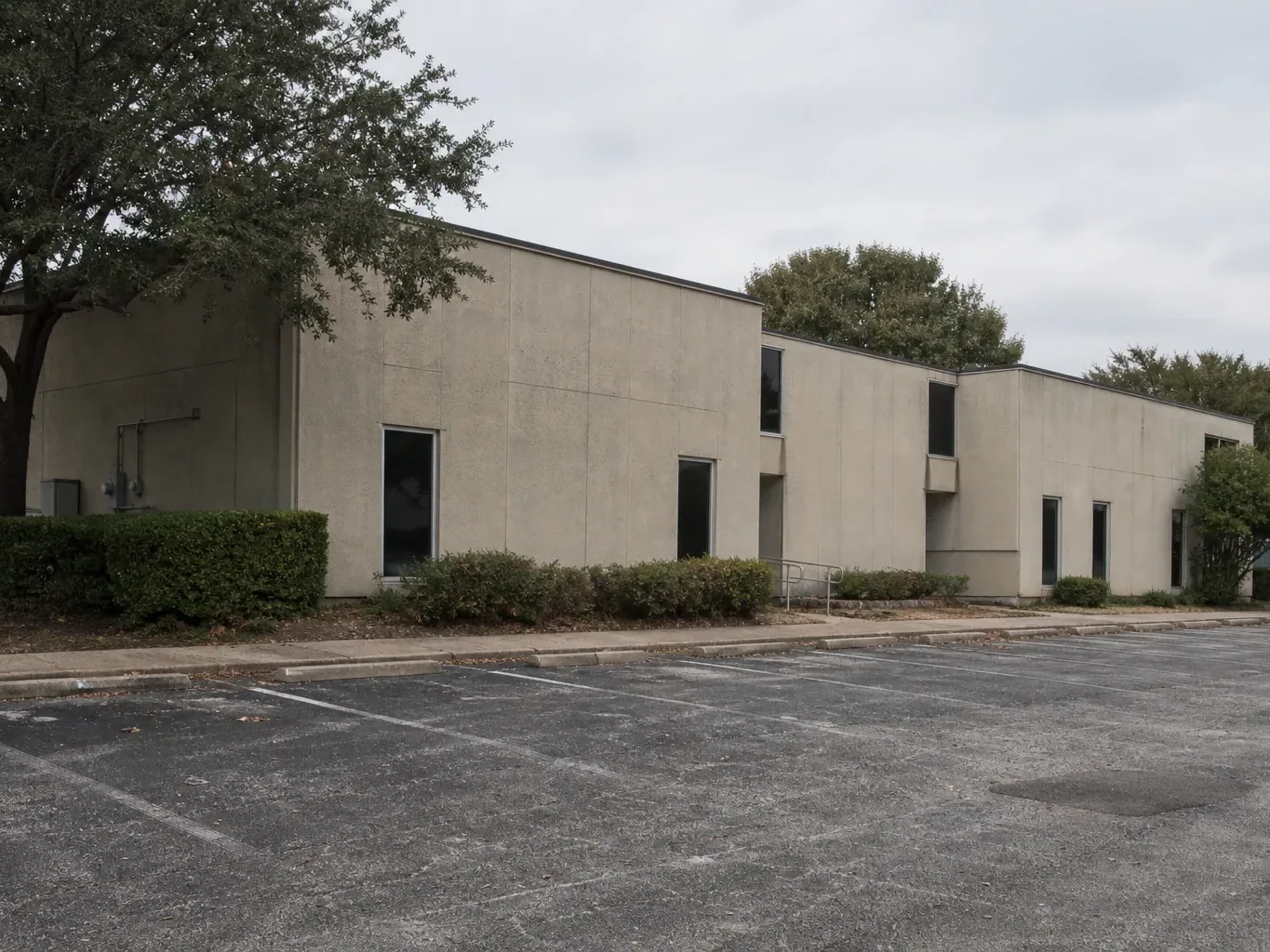 Exposed brick and heavy timber frame an unoccupied suite in a converted Austin commercial building