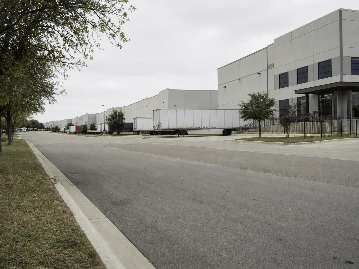 A mixed-use Austin block shows ground-floor retail beneath mid-rise office floors