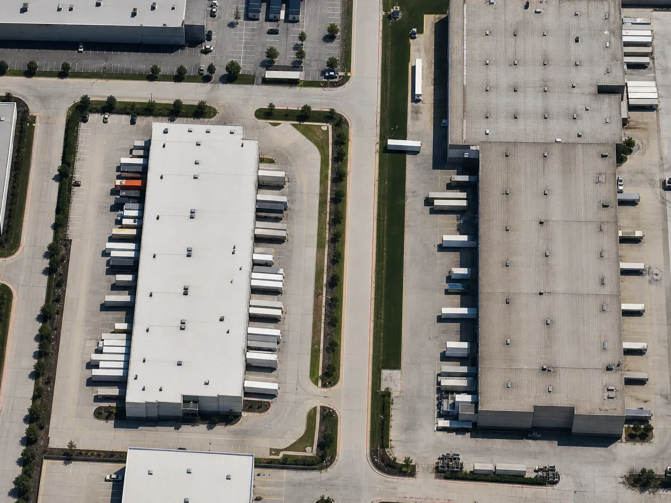 Loading dock doors on an Austin tilt-wall building are seen from the truck court at midday