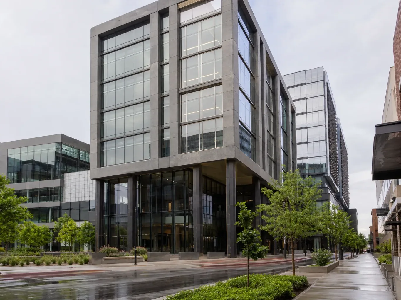 A suburban Austin business-park drive lined with newer Class A office buildings shows the density of development that